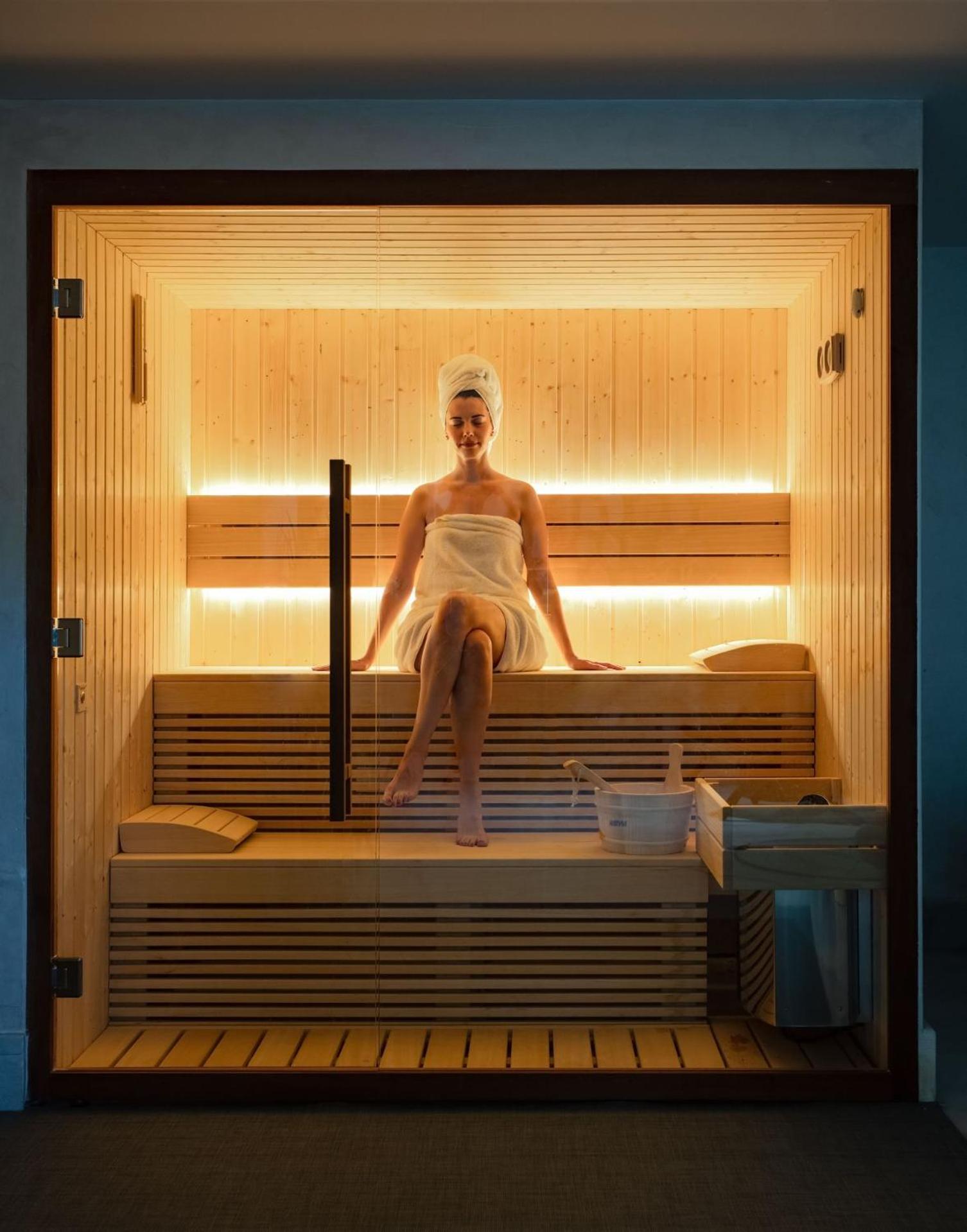 Mitsis Selection Alila Faliraki Exterior foto A woman in a sauna